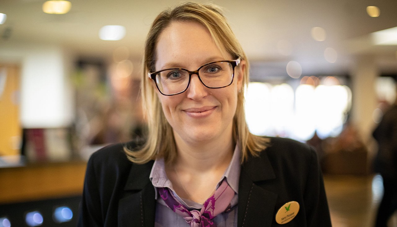 A member of staff at Guest Services.