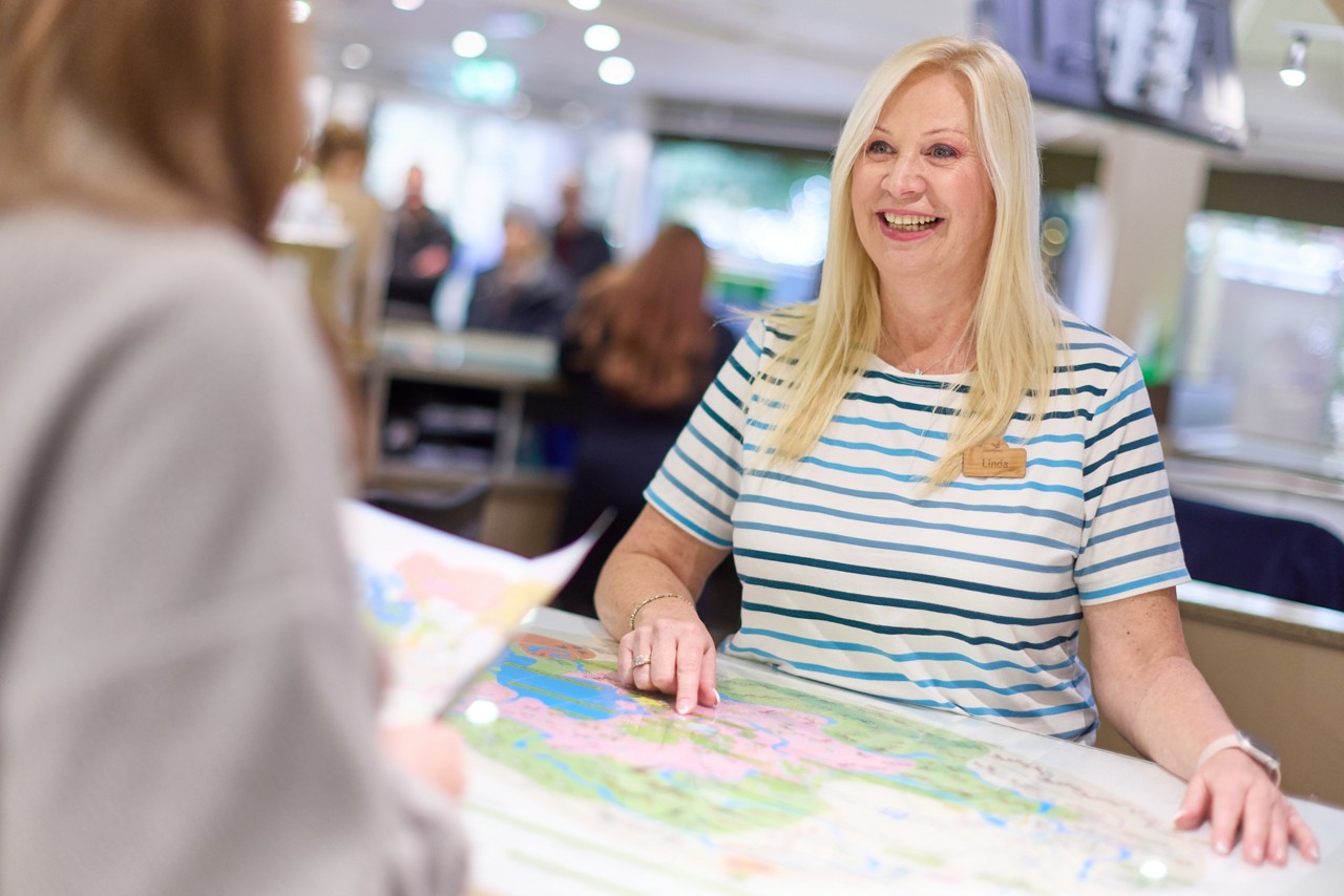 A member of staff at Guest Services.