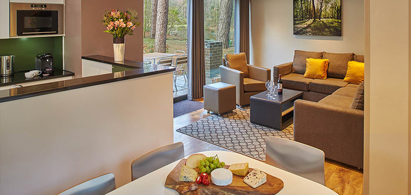The kitchen and living room of a Woodland Lodge.